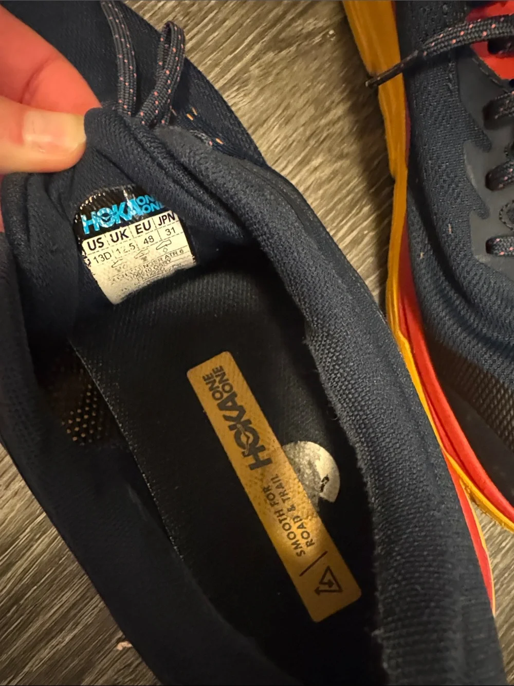 Hoka Men's Navy Athletic Shoes with Red and Yellow Accents